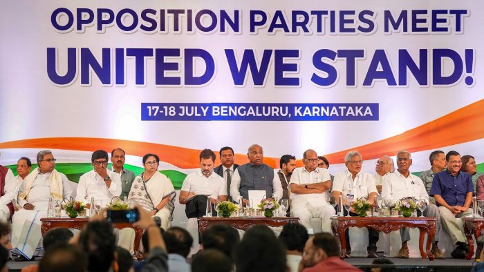 Congress President Mallikarjun Kharge, party leader Rahul Gandhi, West Bengal CM Mamata Banerjee, Delhi CM Arvind Kejriwal, NCP supremo Sharad Pawar and others at a press conference in Bengaluru on July 18, where the opposition parties named their new alliance I.N.D.I.A. Credit: PTI Photo